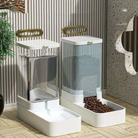 Transparent automatic pet feeder with white base being refilled