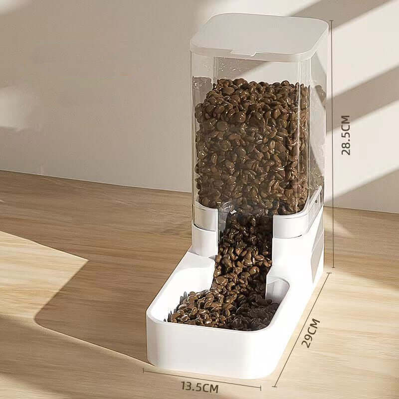 Transparent automatic pet feeder with white base being refilled